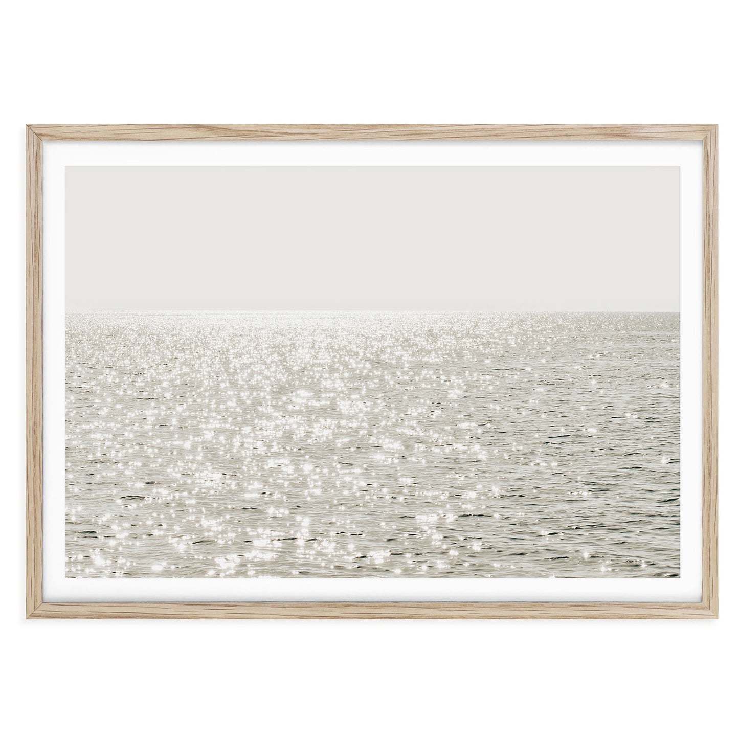 Minimalist coastal photo print featuring sparkling ocean waves under golden sunlight, capturing a serene beach scene in soft, modern tones.