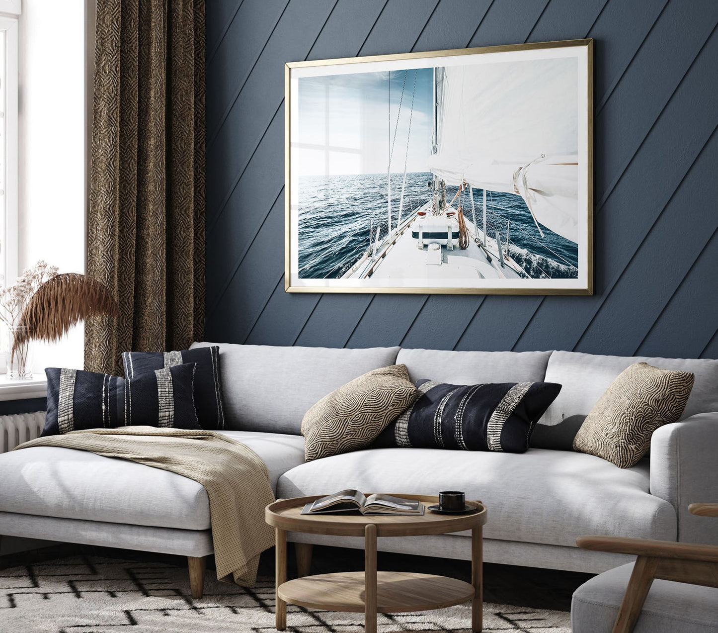 Large sailboat fine art print displayed in a modern living room with neutral decor, adding a coastal and nautical touch to the wall.