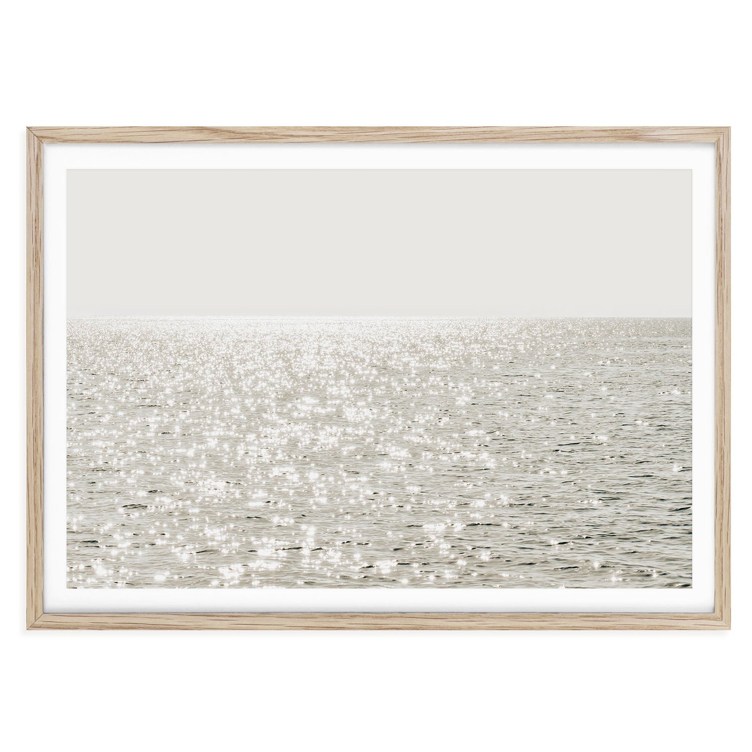 Minimalist coastal photo print featuring sparkling ocean waves under golden sunlight, capturing a serene beach scene in soft, modern tones.