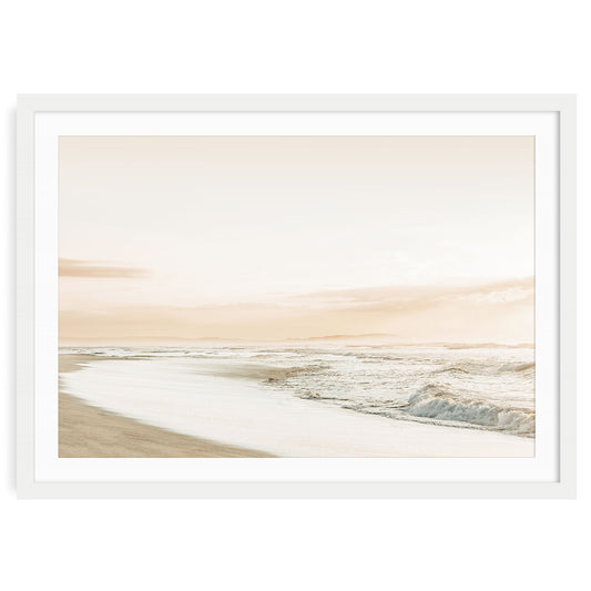 Fine art print of a serene pastel sunset over a calm beach and gentle coastal ocean waves creating peaceful coastal wall art for home decor