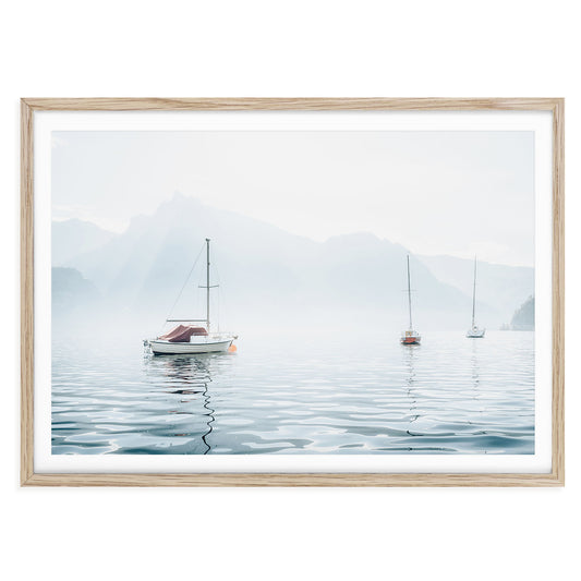 Minimalist nautical wall art featuring sailboats on a calm lake with pastel blue sky, perfect for coastal inspired or serene home decor themes.