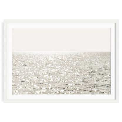 Minimalist coastal photo print featuring sparkling ocean waves under golden sunlight, capturing a serene beach scene in soft, modern tones.
