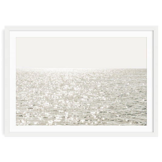 Minimalist coastal photo print featuring sparkling ocean waves under golden sunlight, capturing a serene beach scene in soft, modern tones.