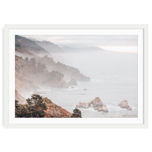 Misty Big Sur coastal landscape print featuring soft ocean cliffs, fog rolling over the shoreline, and muted blue tones for calming home wall decor.