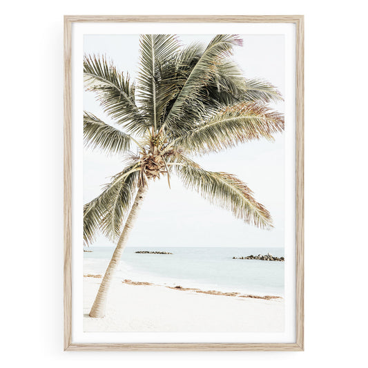 Tropical island palm tree wall art print with soft minimalist beach tones, perfect for resort-style and coastal home decor.