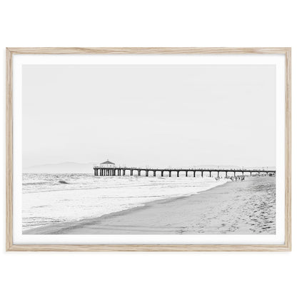 Black and white fine art photograph of Manhattan Beach Pier with ocean waves and horizon, coastal photography wall art print for modern home or office decor