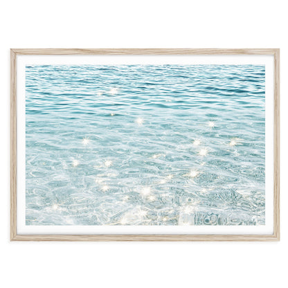 Sparkling ocean water fine art print featuring sunlight reflections on gentle blue waves, perfect coastal wall art for beach-inspired home décor