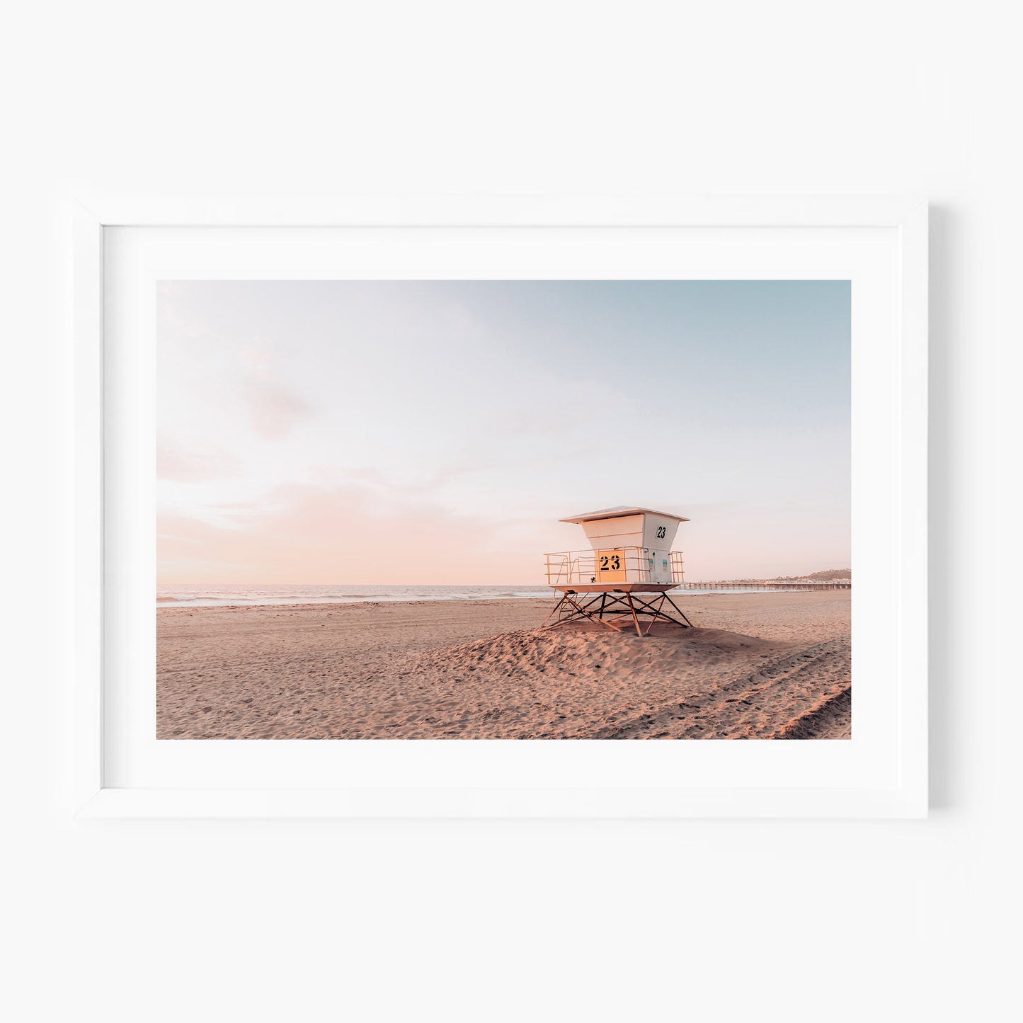 California beach sunset with lifeguard tower.