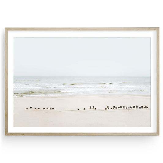 Neutral beach wall art featuring a minimalist ocean scene in soft tones, horizontal framed seascape print for calming coastal home decor.
