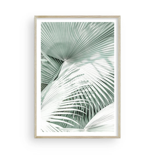Framed boho palm tree wall art featuring soft mint green tones and tropical foliage in a minimalist coastal photography style, perfect for beach decor.