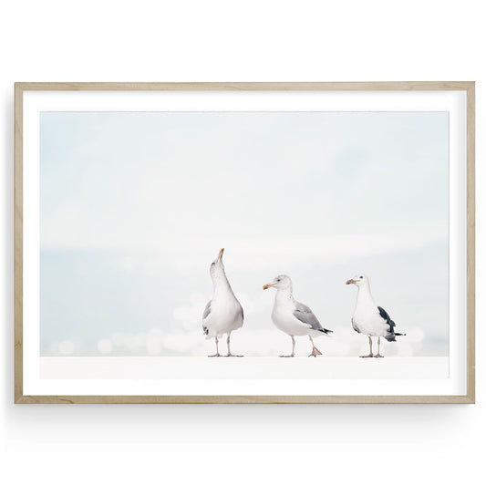 Seagull fine art print featuring a single bird by the beach in soft, neutral tones. This coastal-style artwork adds charm and calm to nursery or beach-inspired rooms.