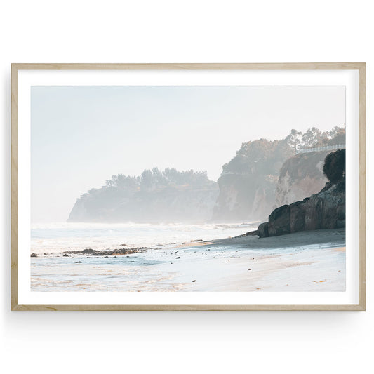 Framed Malibu beach fine art print featuring soft surf and neutral ocean tones. A muted coastal landscape capturing serene California shoreline beauty.