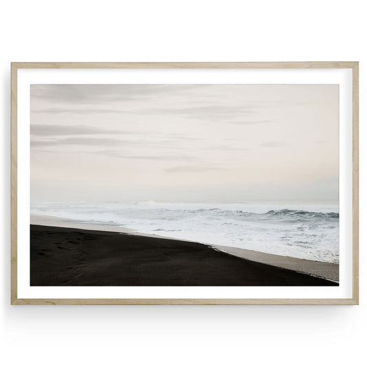 Black Sand Beach fine art print featuring moody coastal seascape with black sand shoreline and ocean waves, minimalist framed or unframed wall decor