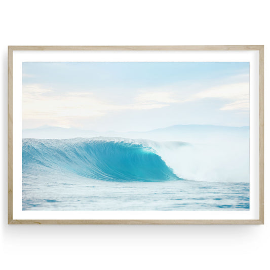 Close-up photo of a blue ocean wave barrel curling in motion. Fine art surf photography that adds dynamic coastal energy and depth to modern wall spaces.