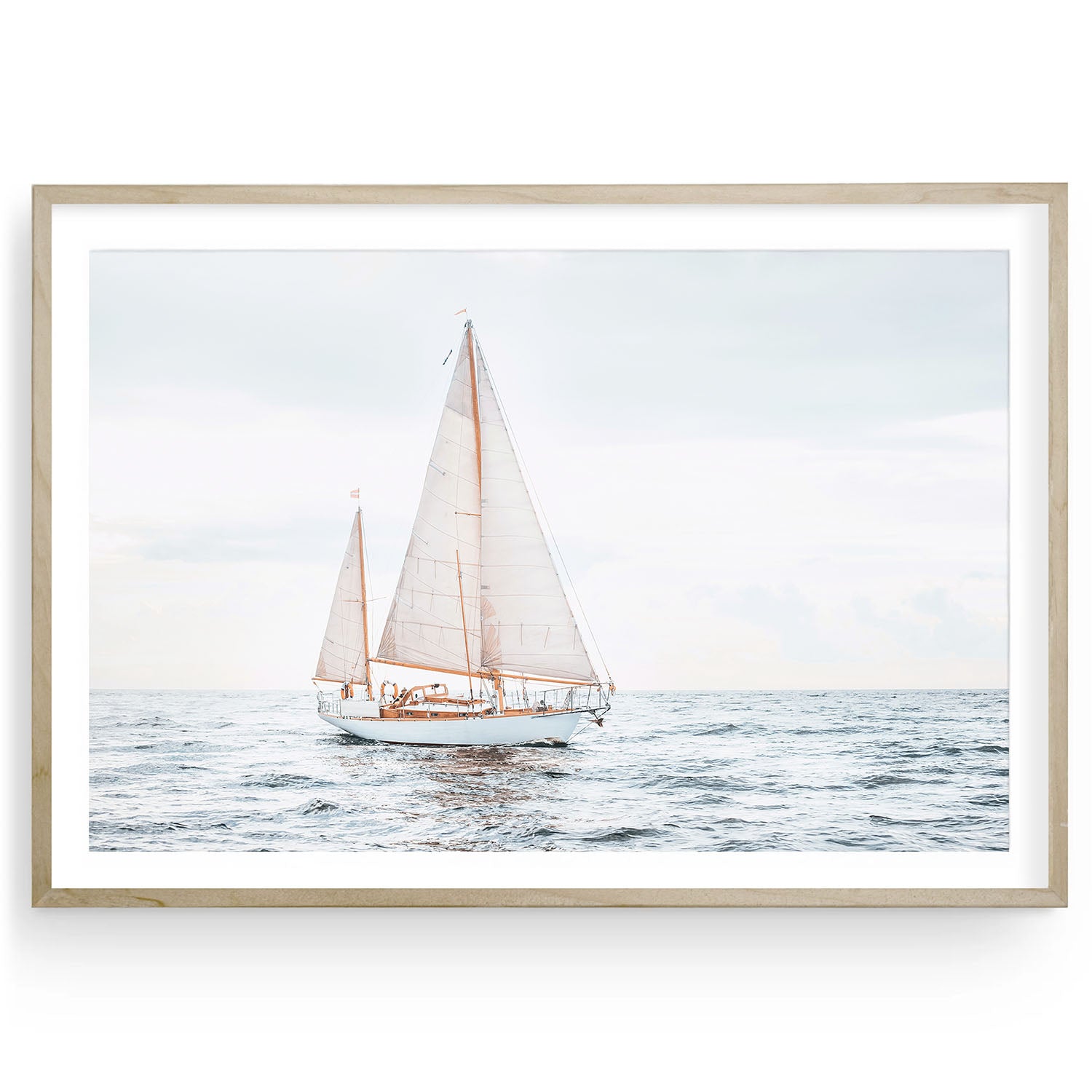 Oversized sailboat art print in modern wooden frame on plain background, minimalist coastal wall decor for beach or lake house.
